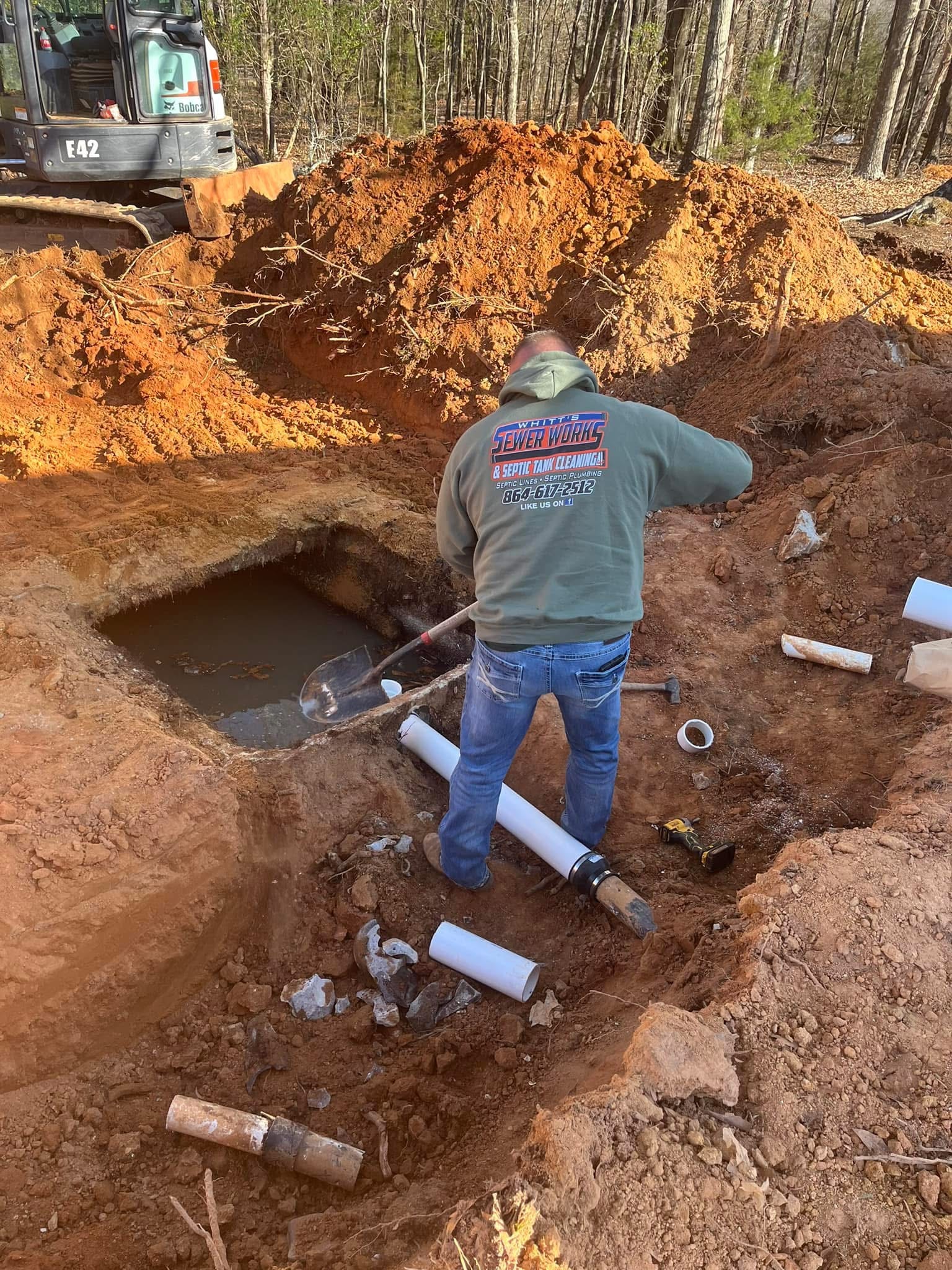 Septic system excavation and installation in progress